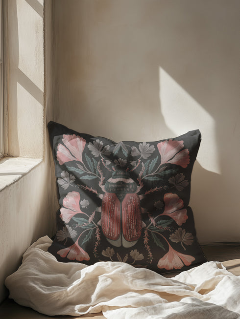 Elegant black pillowcase featuring detailed coral-red beetle illustration centered amid symmetrical pink flowers and gray-green foliage. The dark background enhances the intricate entomology artwork with fine detailing throughout the botanical and insect elements.